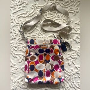 Coach cross body bag. Purple/orange. Adjustable strap. Used, great condition.